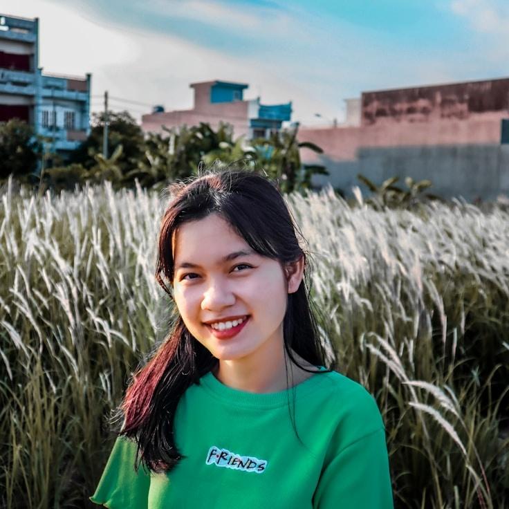 Avery Chen, Lead Design Curator at Lively Canvas Hub, reviewing corporate floral arrangements